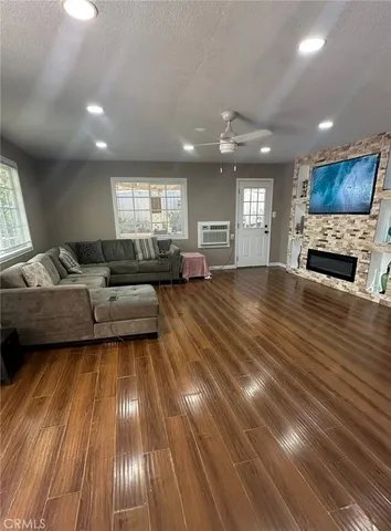a living room with furniture and kitchen view