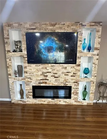 a view of living room with furniture and flat screen tv