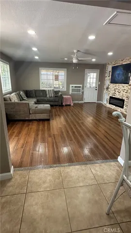 a room with lots of furniture and a flat screen tv