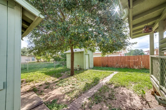 a view of backyard with a garden and entertaining space