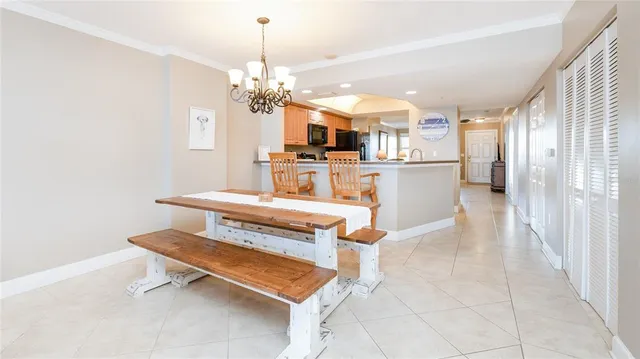 a view of a bedroom with wooden floor and flat screen tv
