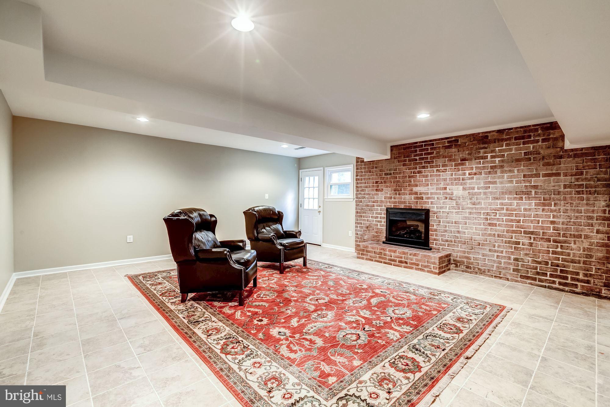 5429 Richenbacher Avenue Alexandria, VA 22304 - Photo 20 of 31 Walkout lower level with electric Fireplace