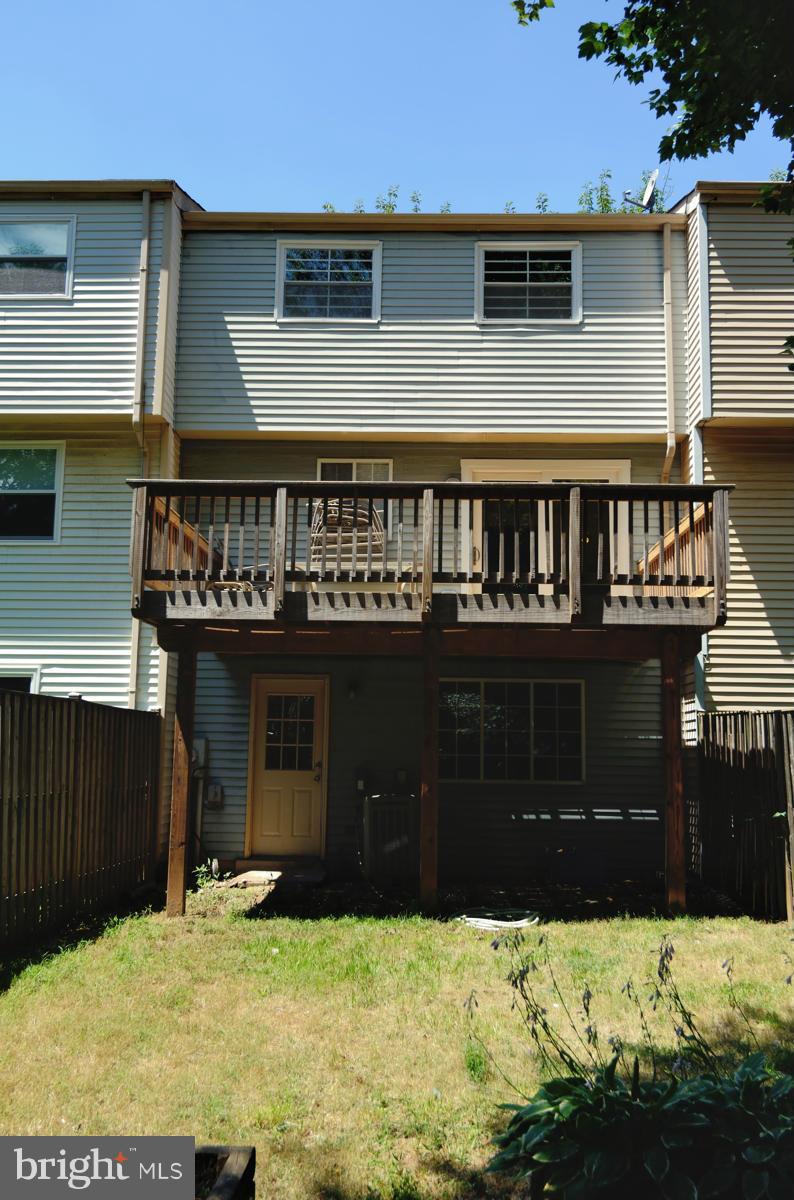 10334 Apple Ridge Road Gaithersburg, MD 20886 - Photo 18 of 18 a view of a house with wooden fence