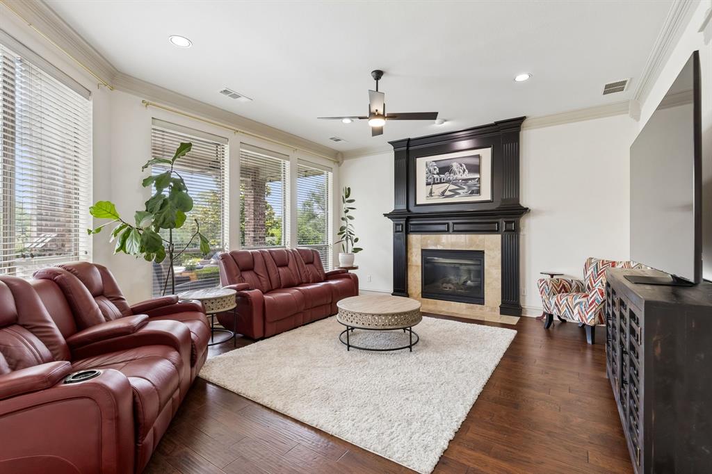 8517 Navigation Drive Rowlett, TX 75088 - Photo 10 of 39 a living room with furniture a large window and a fireplace