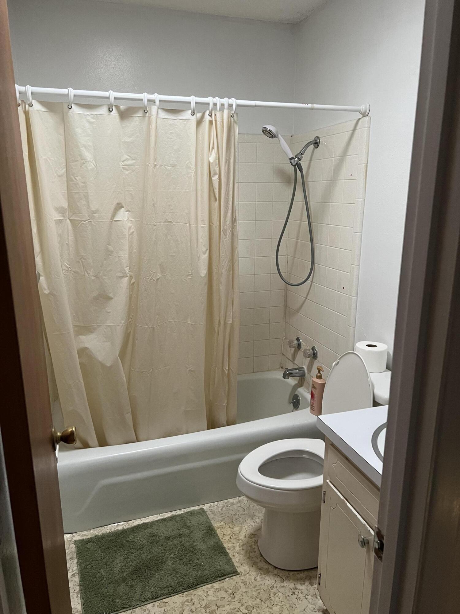 3693 Airport Road Crestview, FL 32539 - Photo 17 of 18 a bathroom with a toilet and a shower
