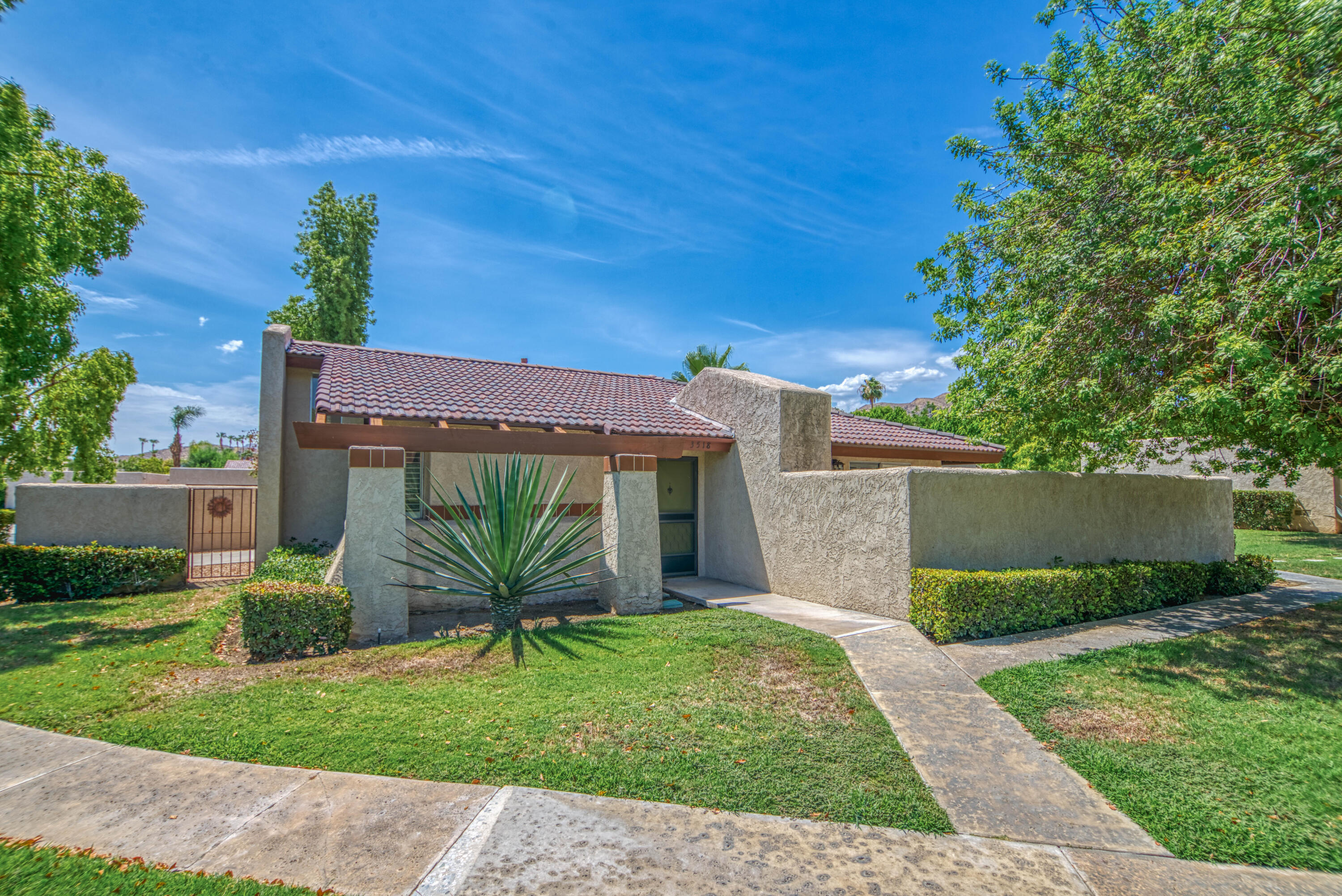 3518 Ridgeview Circle South Palm Springs, CA 92264 - Photo 11 of 32 a view of a house with a yard