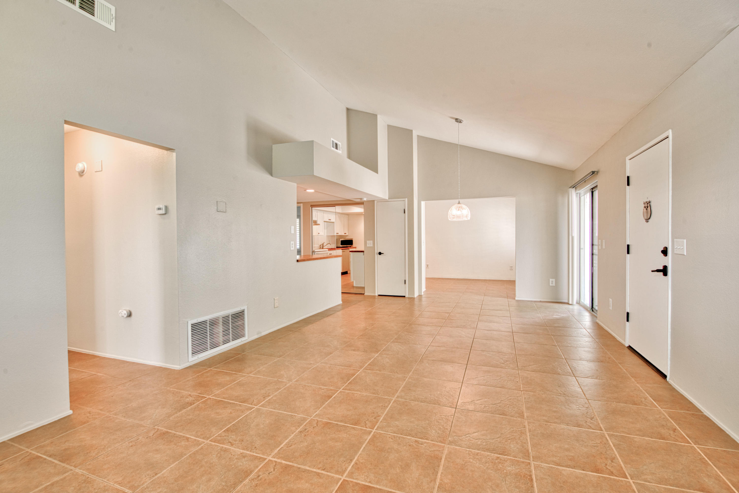3518 Ridgeview Circle South Palm Springs, CA 92264 - Photo 19 of 32 a view of a big room with entryway and chandelier