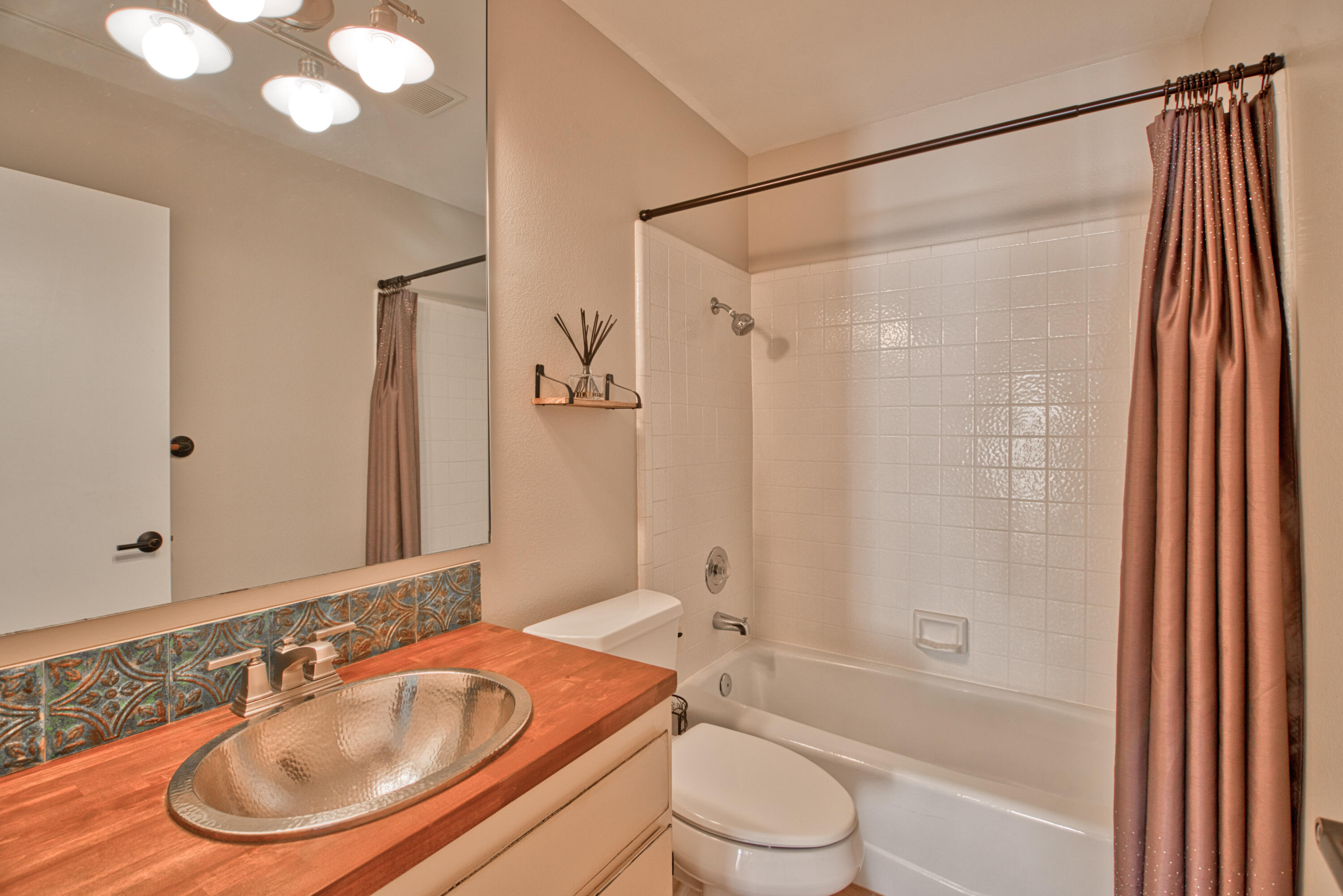 3518 Ridgeview Circle South Palm Springs, CA 92264 - Photo 22 of 32 a bathroom with a sink and a mirror
