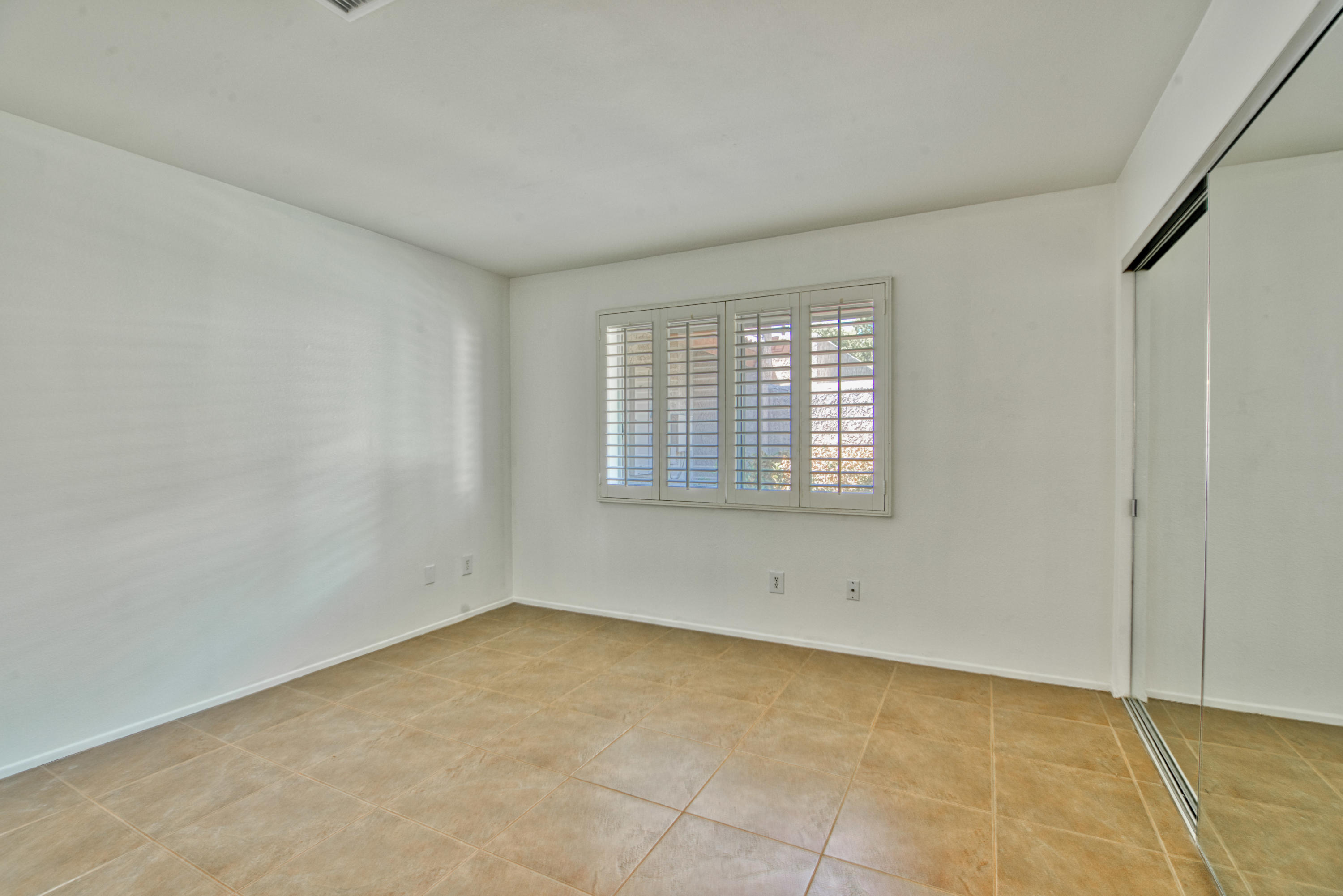 3518 Ridgeview Circle South Palm Springs, CA 92264 - Photo 23 of 32 a view of an empty room with a window