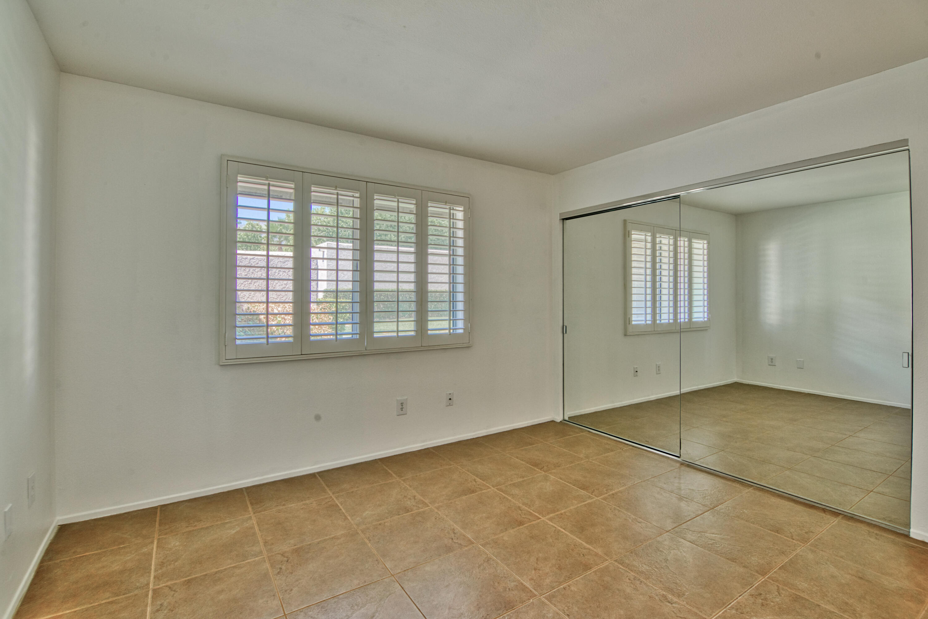 3518 Ridgeview Circle South Palm Springs, CA 92264 - Photo 24 of 32 an empty room with windows