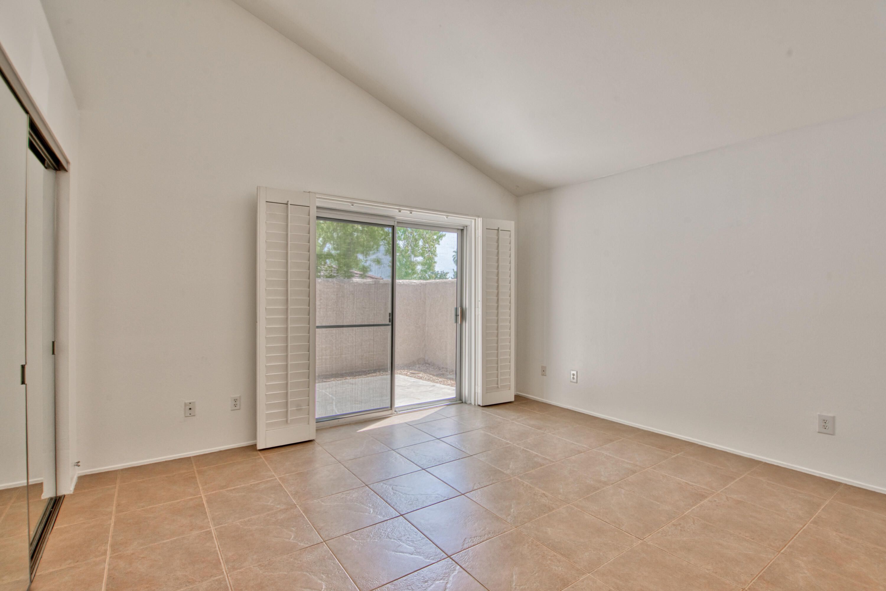 3518 Ridgeview Circle South Palm Springs, CA 92264 - Photo 26 of 32 an empty room with sliding door