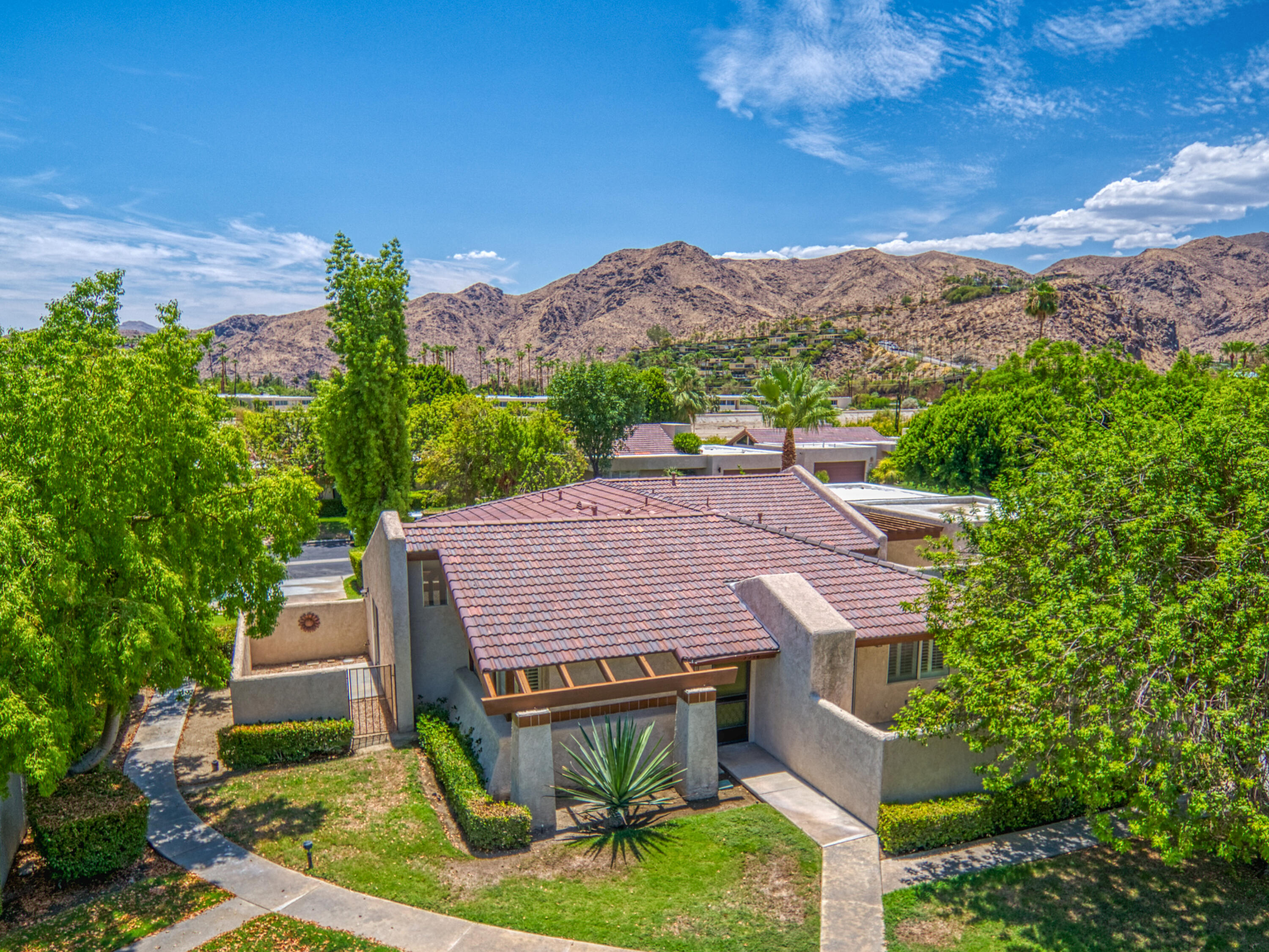 3518 Ridgeview Circle South Palm Springs, CA 92264 - Photo 10 of 32 an aerial view of a house with a yard and mountain view in back