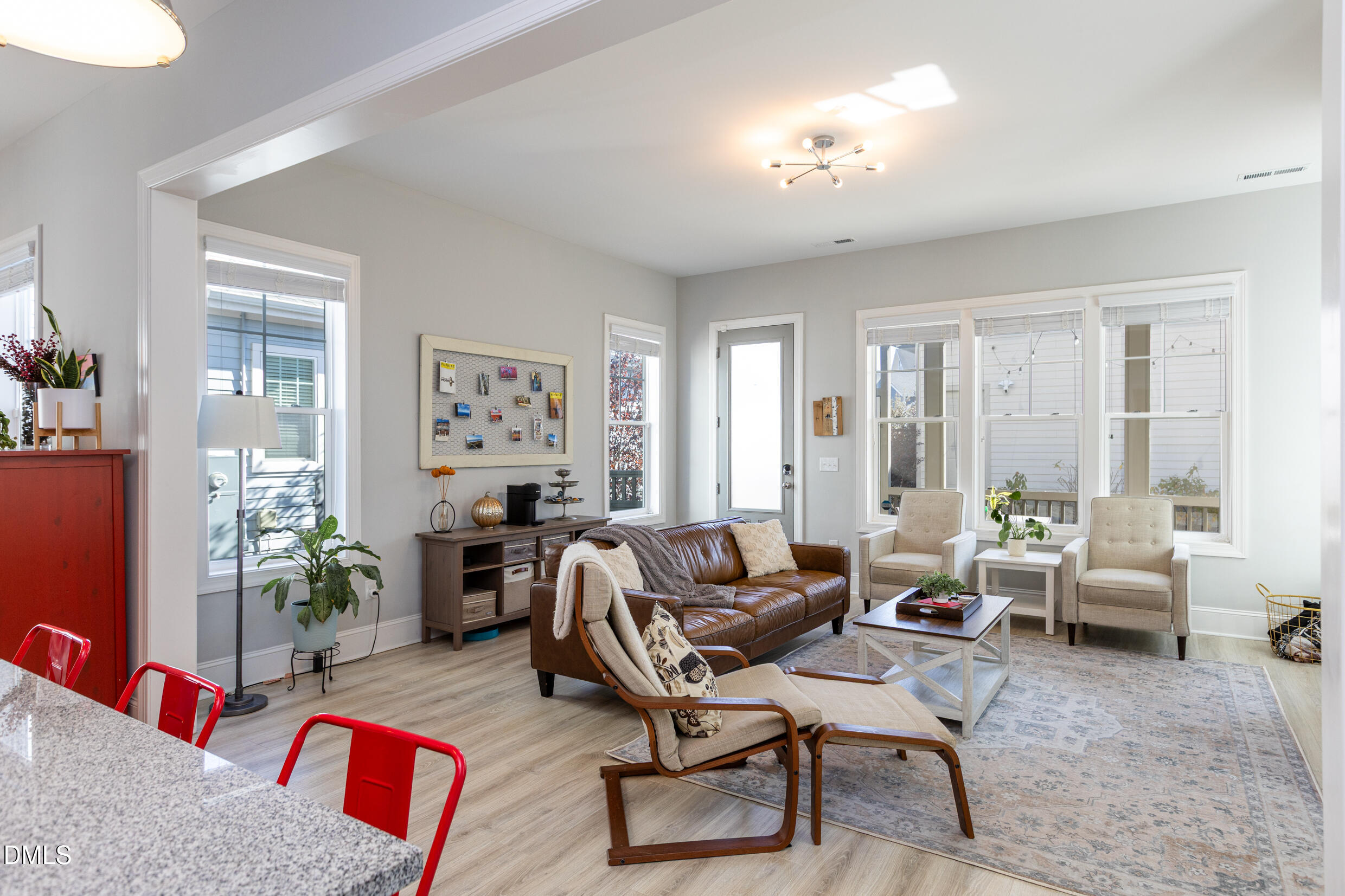 1103 Tannin Drive Durham, NC 27713 - Photo 12 of 28 a living room with furniture and a chandelier