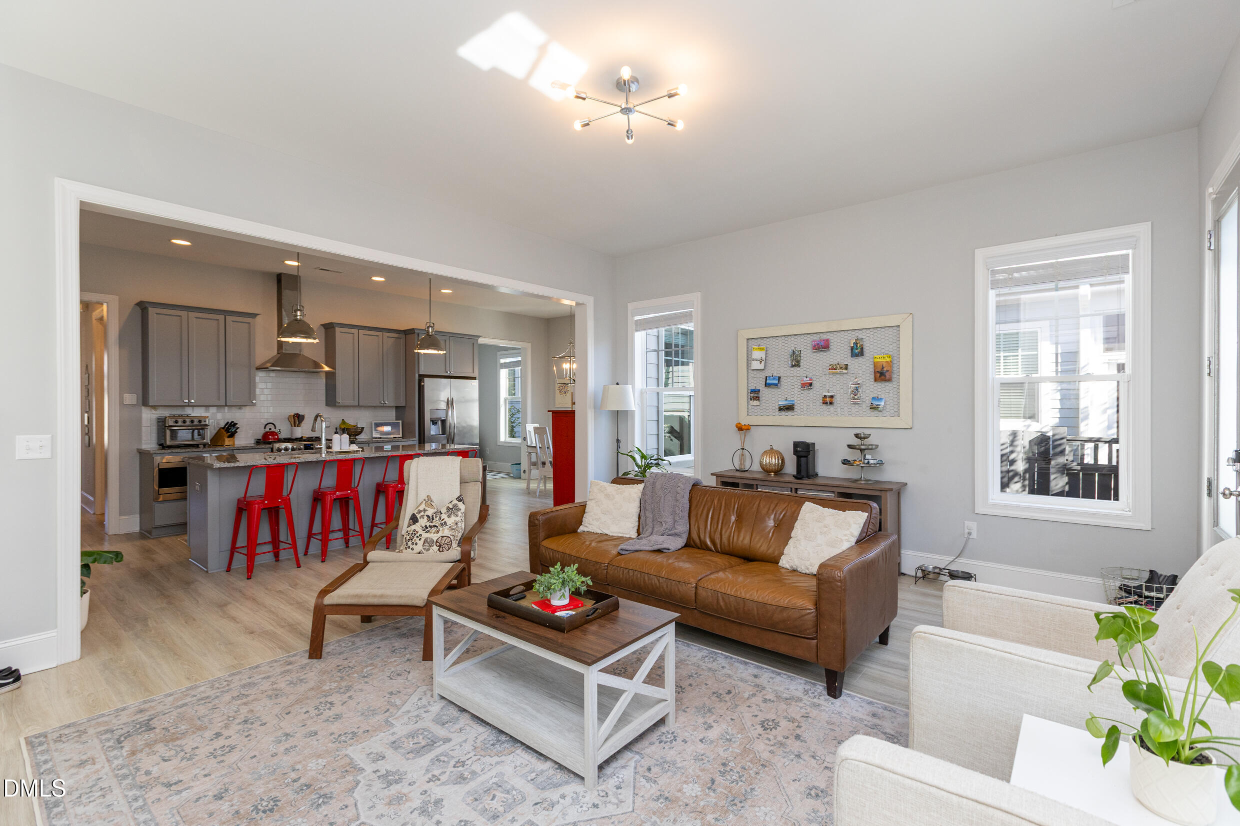 1103 Tannin Drive Durham, NC 27713 - Photo 13 of 28 a living room with furniture kitchen view and a window