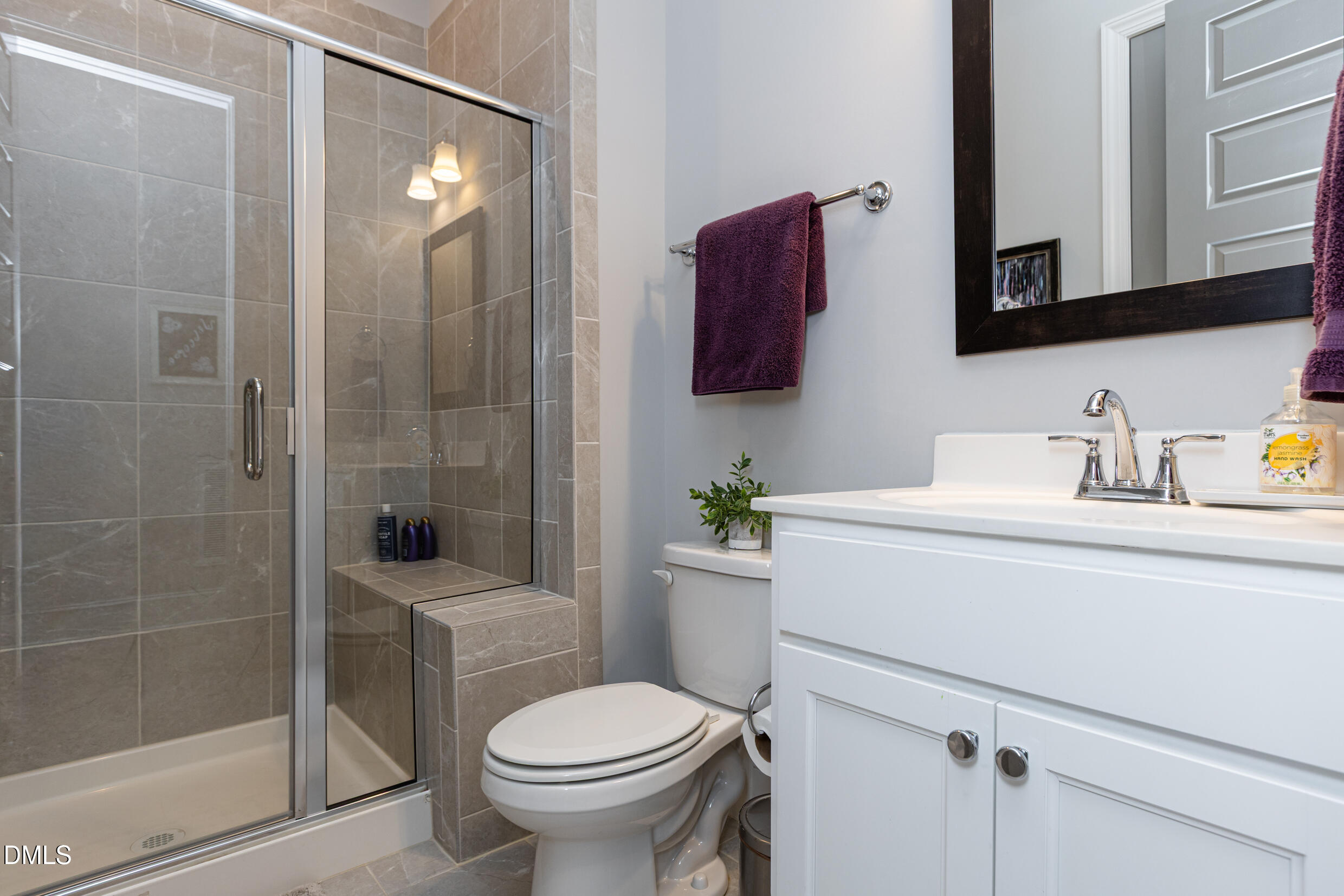 1103 Tannin Drive Durham, NC 27713 - Photo 16 of 28 a bathroom with a sink toilet and shower