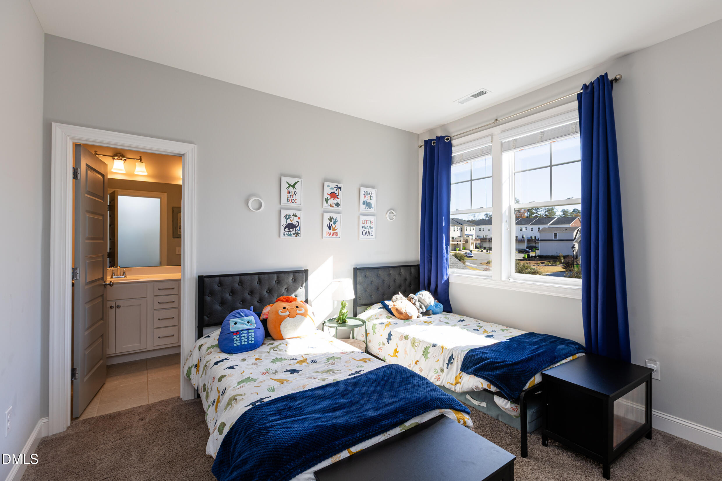 1103 Tannin Drive Durham, NC 27713 - Photo 17 of 28 a bedroom with furniture and a window