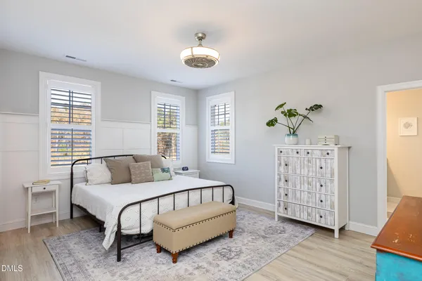a bedroom with furniture and a window