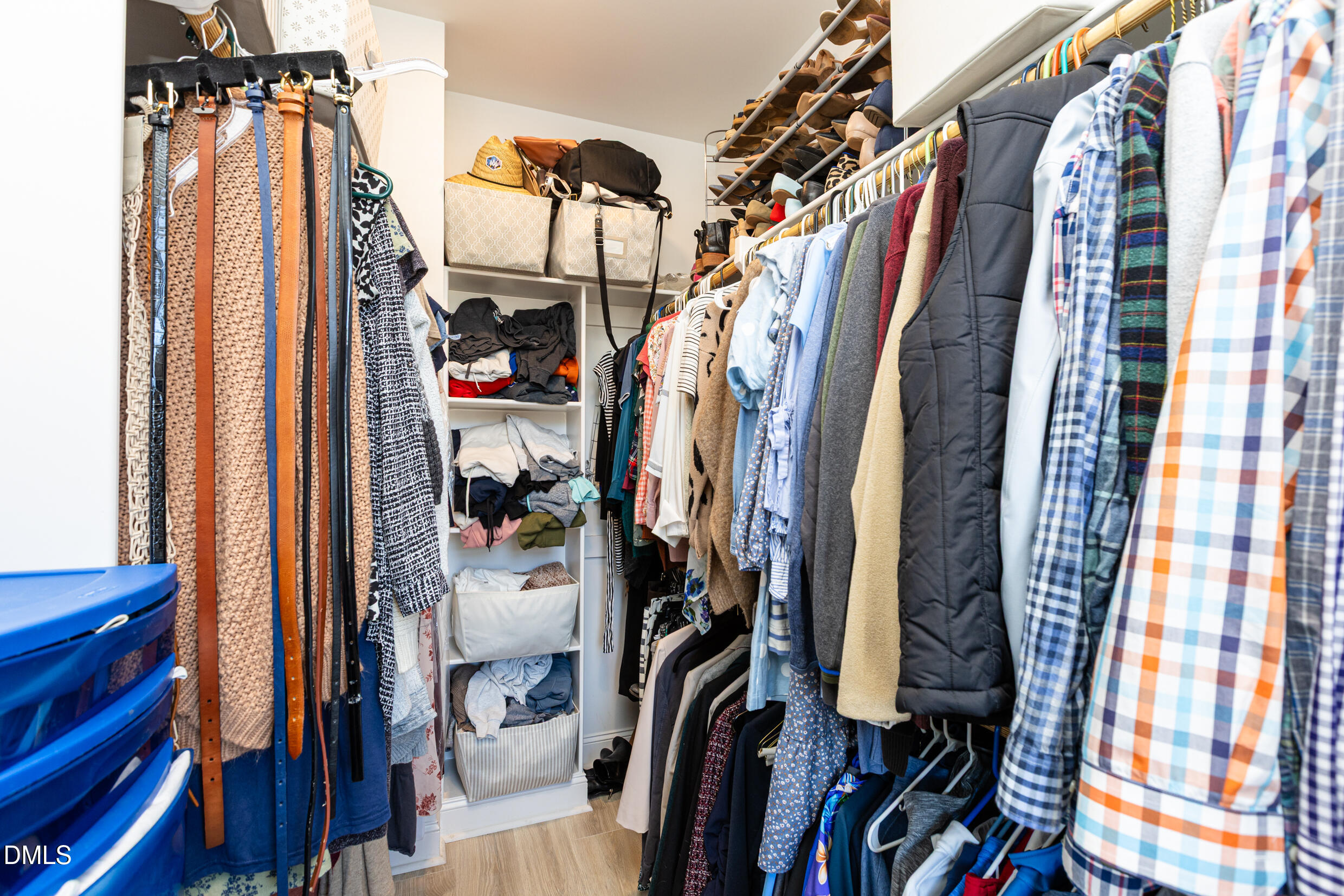 1103 Tannin Drive Durham, NC 27713 - Photo 22 of 28 a view of walk in closet with clothes and shoes