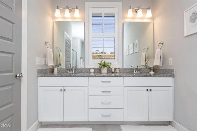 a bathroom with cabinets and sink
