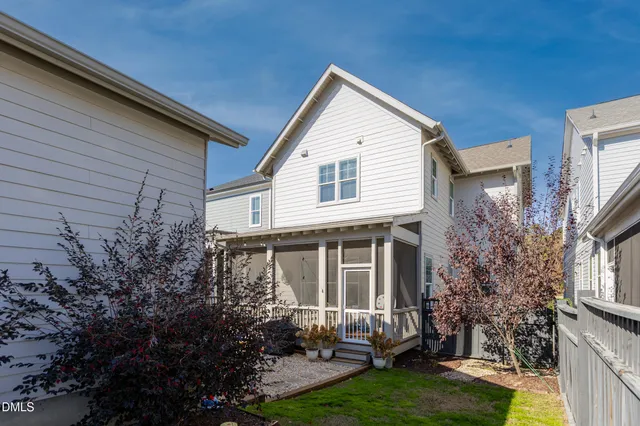 a front view of a house with yard and green space