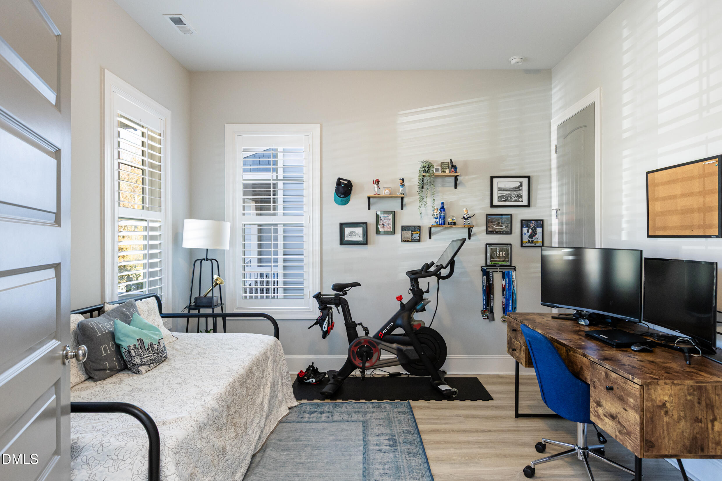 1103 Tannin Drive Durham, NC 27713 - Photo 6 of 28 a bedroom with furniture a flat screen tv and a window