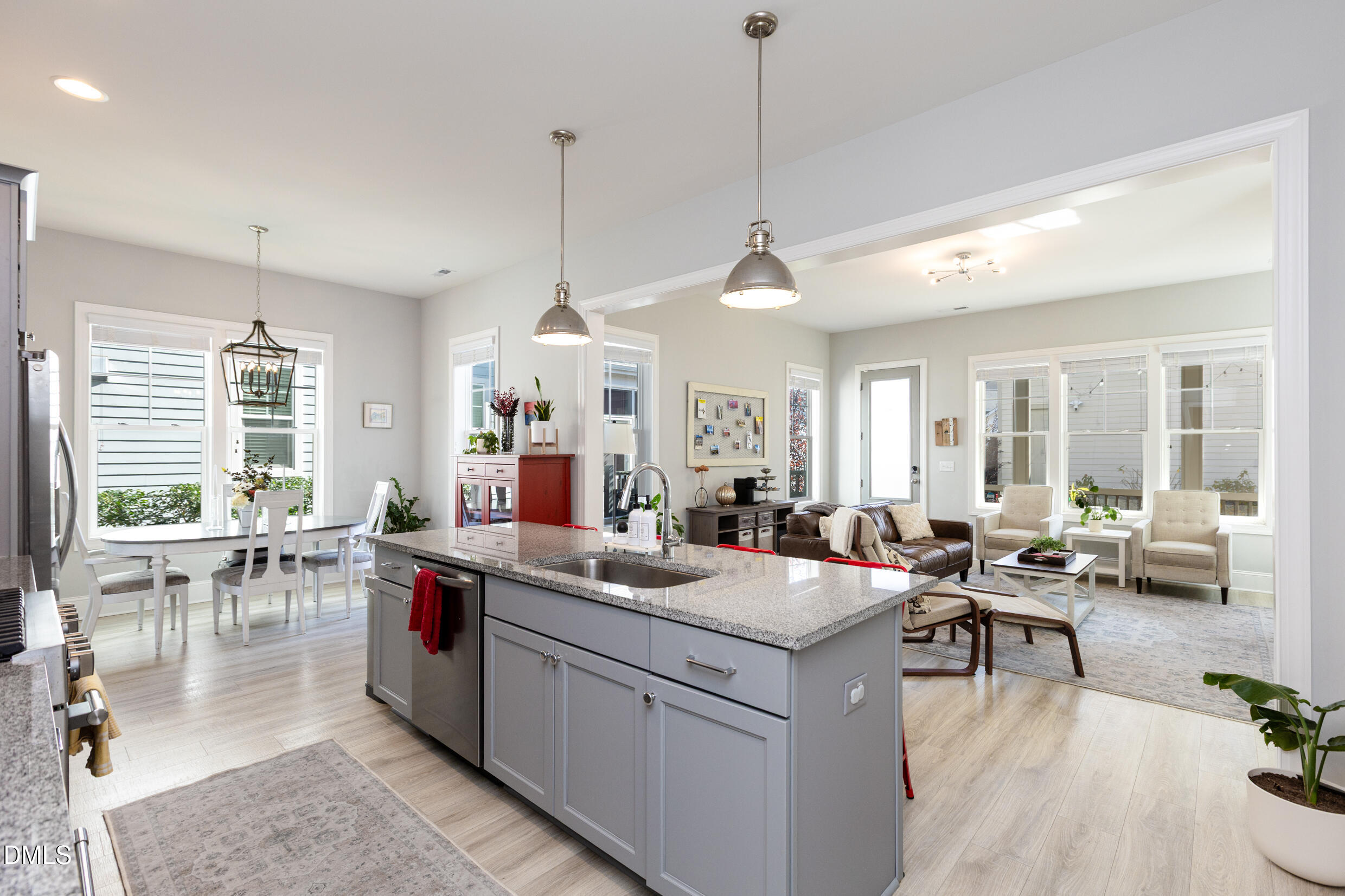 1103 Tannin Drive Durham, NC 27713 - Photo 7 of 28 a large kitchen with a large counter top furniture appliances and a view of living room