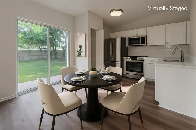 a view of a dining room with furniture window and outside view