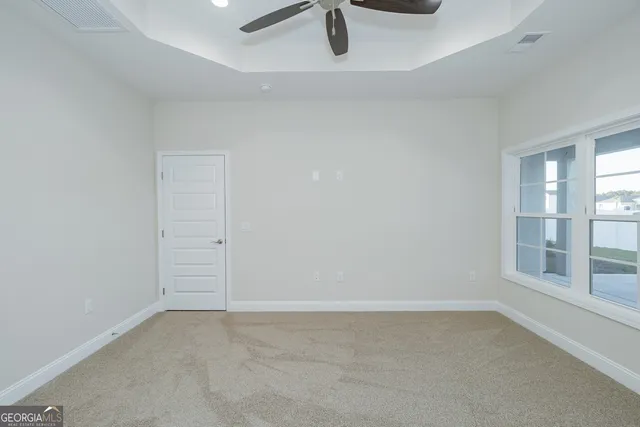 an empty room with glass door