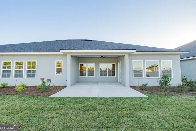 front view of a house with a yard