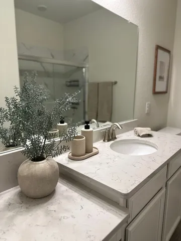 a bathroom with a sink and a mirror