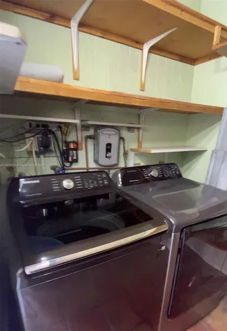 a stove top oven sitting inside of a kitchen