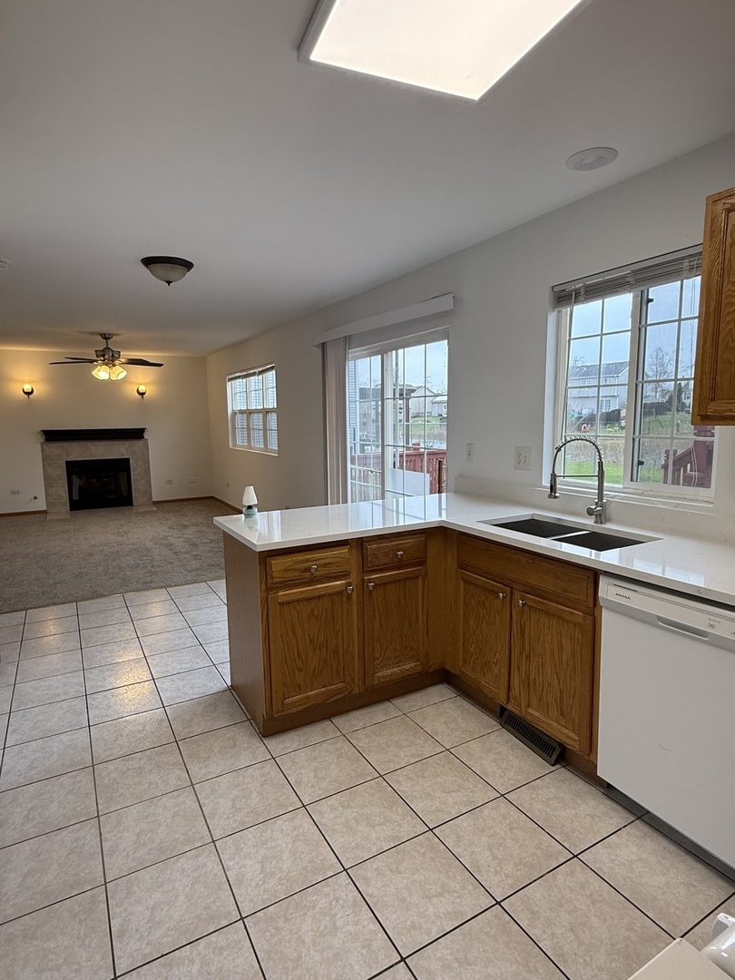 1004 Ann Street Joliet, IL 60435 - Photo 12 of 33 a kitchen with stainless steel appliances granite countertop a sink and a counter top space