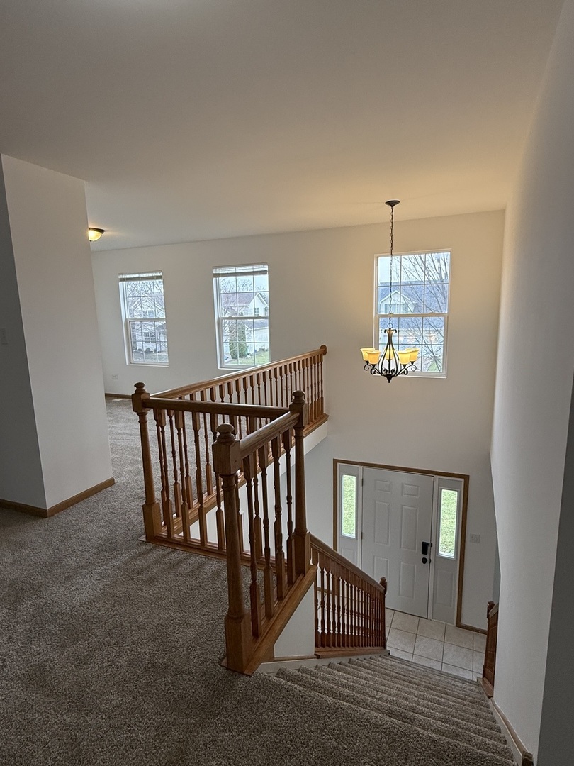 1004 Ann Street Joliet, IL 60435 - Photo 16 of 33 a view of a hallway with windows and stairs