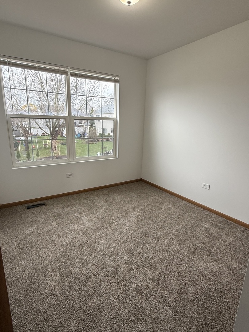 1004 Ann Street Joliet, IL 60435 - Photo 21 of 33 an empty room with a window