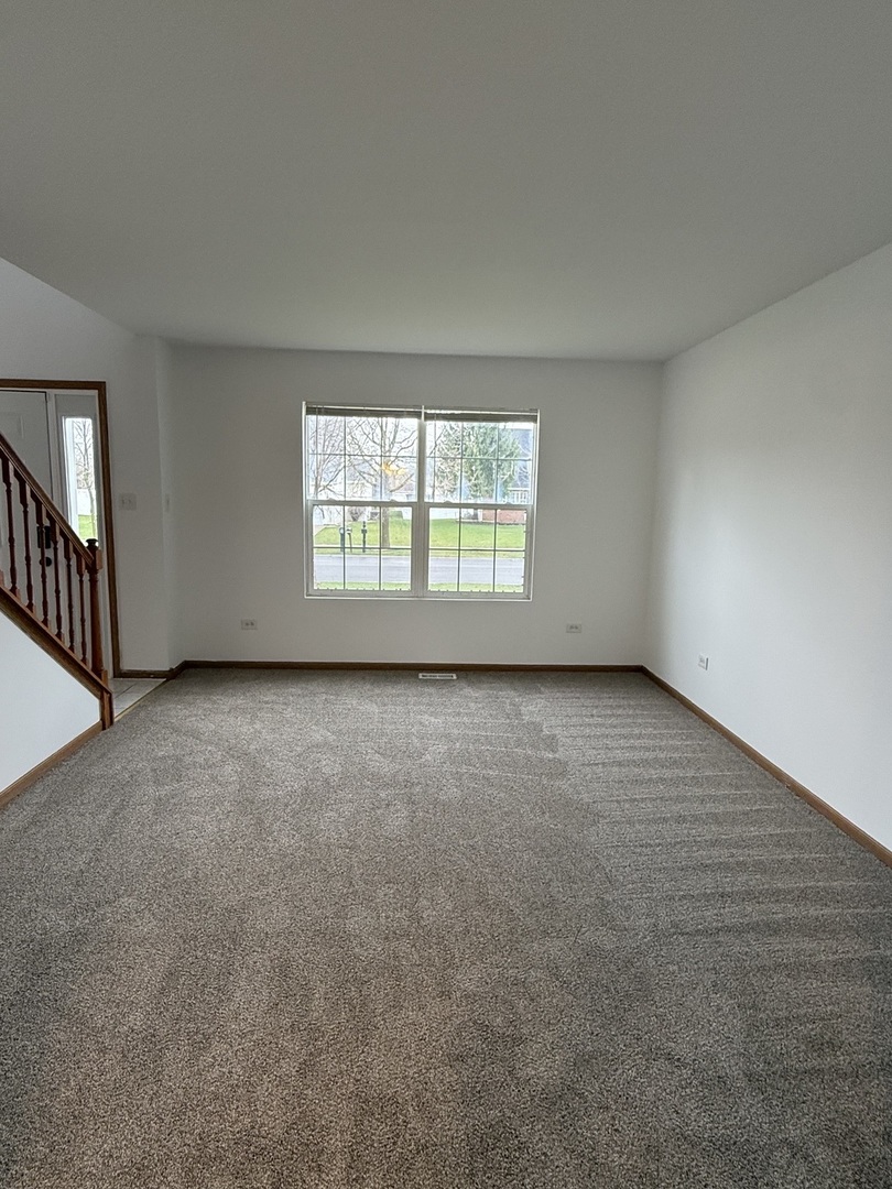 1004 Ann Street Joliet, IL 60435 - Photo 3 of 33 an empty room with windows