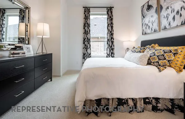 a bedroom with a bed and a night stand