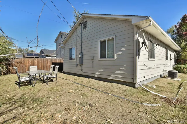 a view of a backyard with sitting area