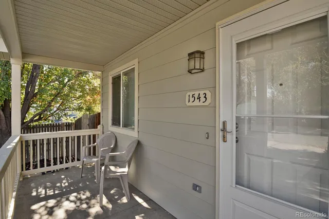 a view of a porch with furniture