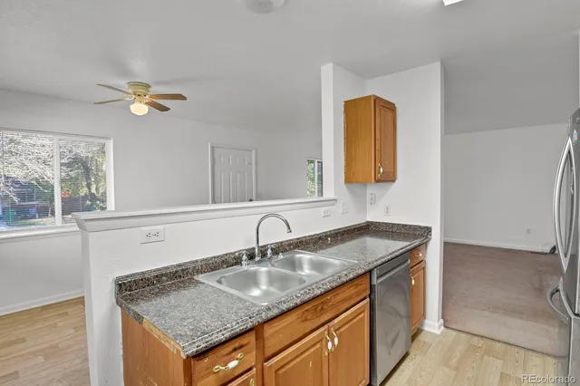 a bathroom with a granite countertop sink a vanity and mirror