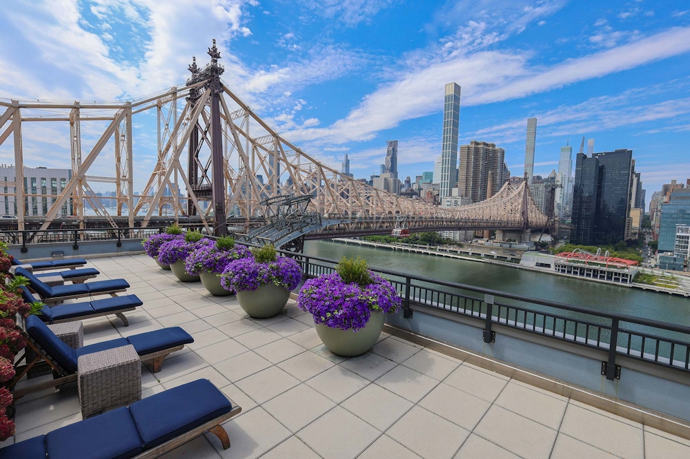 405 Main Street, Unit 9D Manhattan, NY 10044 - Photo 5 of 15 a view of a terrace with furniture