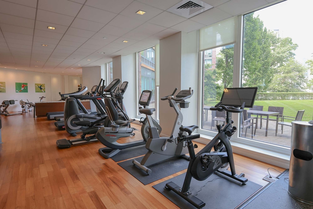 405 Main Street, Unit 9D Manhattan, NY 10044 - Photo 7 of 15 a view of a room with gym equipment