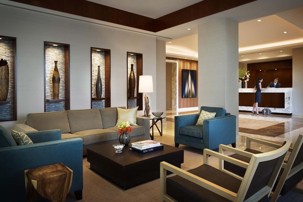 405 Main Street, Unit 9D Manhattan, NY 10044 - Photo 10 of 15 a living room with furniture