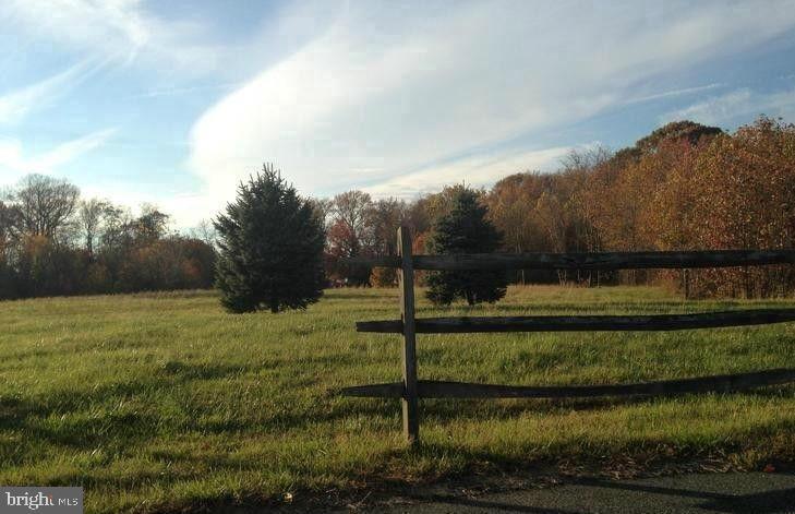 660 Otter Creek Road Edgewood, MD 21040 - Photo 2 of 3 a view of a garden with a bench