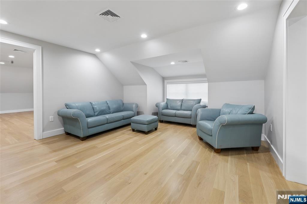 31 Engleside Street Cresskill, NJ 07626 - Photo 24 of 49 a living room with furniture and a wooden floor