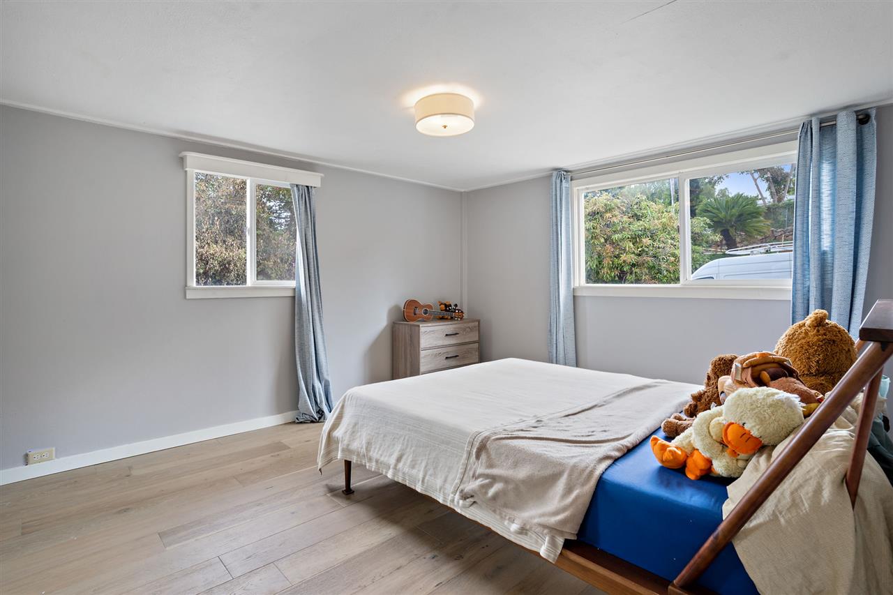 3655 Lower Kula Road Kula, HI 96790 - Photo 22 of 30 a bedroom with a bed and wooden floor