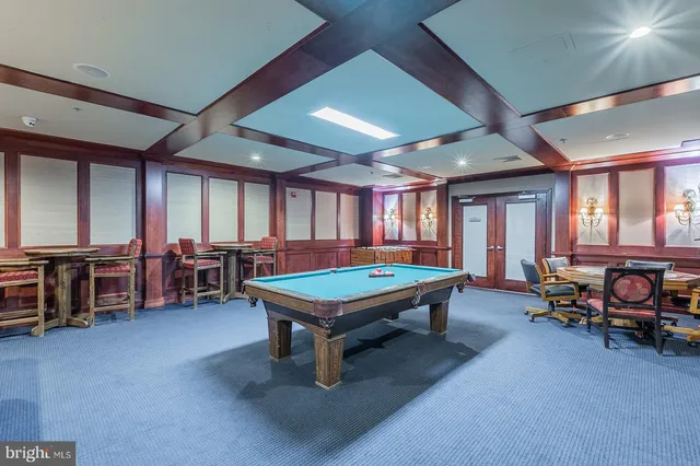 front view of a brick house with a yard