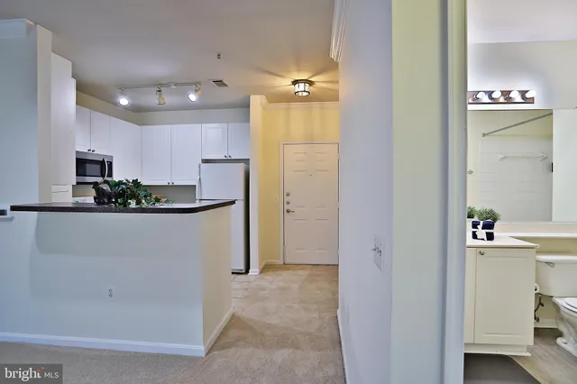 a bathroom with a sink a faucet a mirror and a shower
