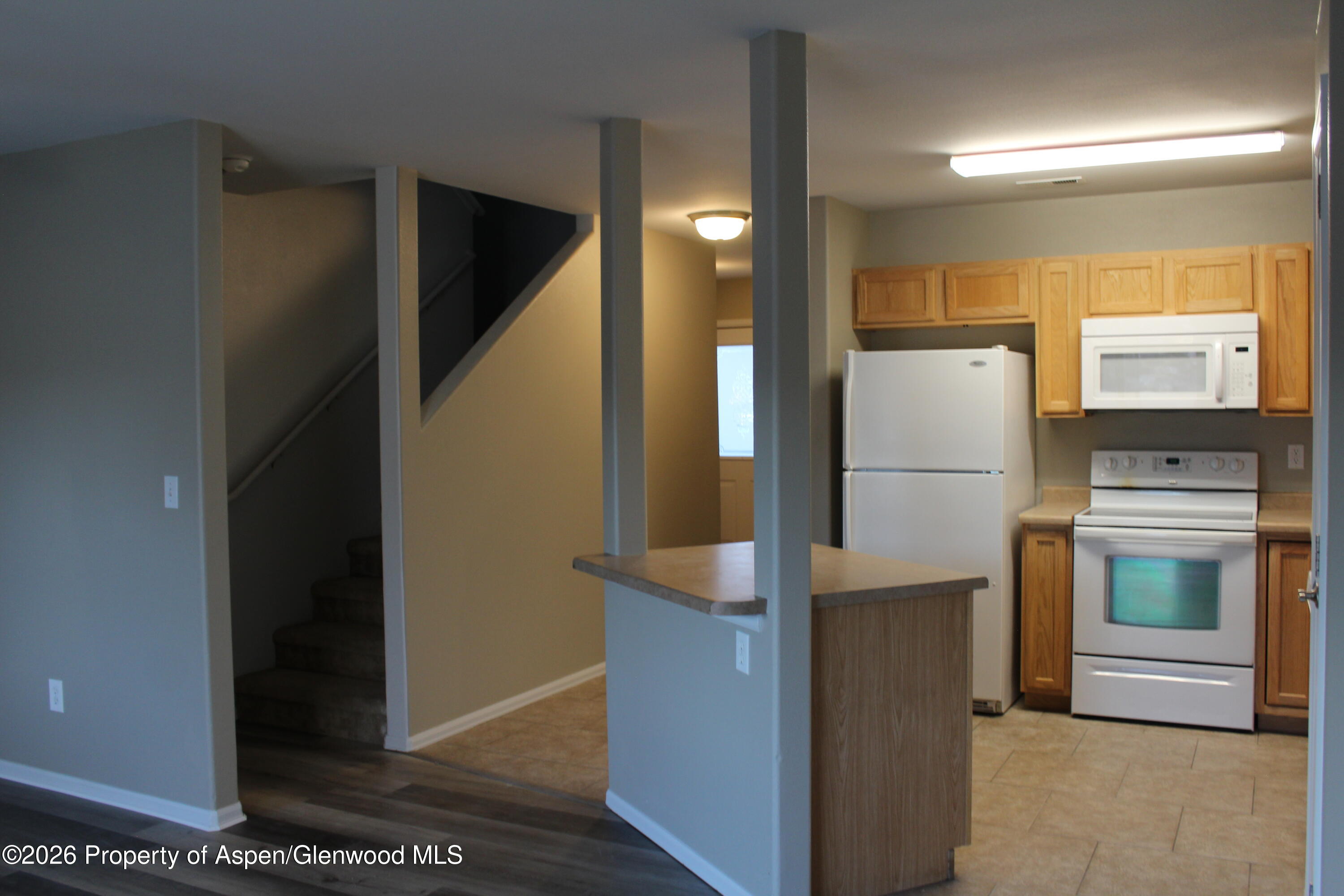 21 Bryan Loop Parachute, CO 81635 - Photo 2 of 8 a kitchen with a refrigerator and a stove
