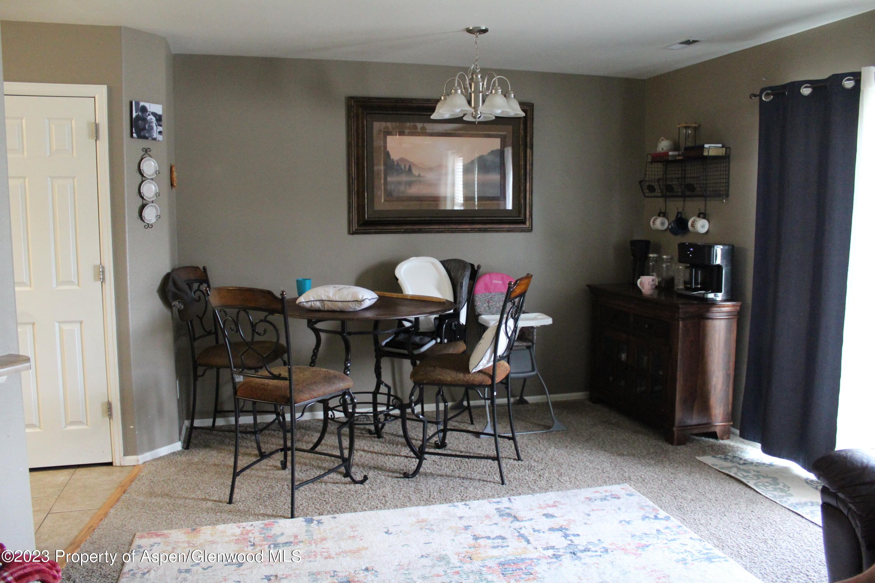 21 Bryan Loop Parachute, CO 81635 - Photo 3 of 8 a view of a dining room with furniture