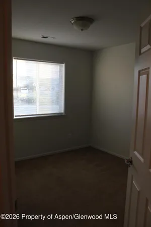 a bathroom with a toilet a sink and shower